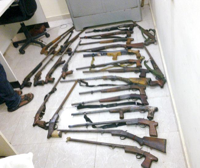 The 25 firearms that the police recovered from the accused
