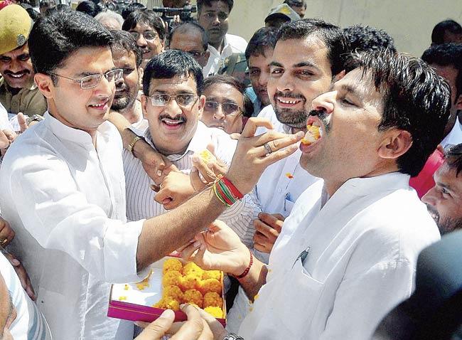 Rajasthan Congress President Sachin Pilot celebrates with party workers in Jaipur. The Congress won three of the four assembly seats in the state, while the ruling BJP won only one. Pic/PTI