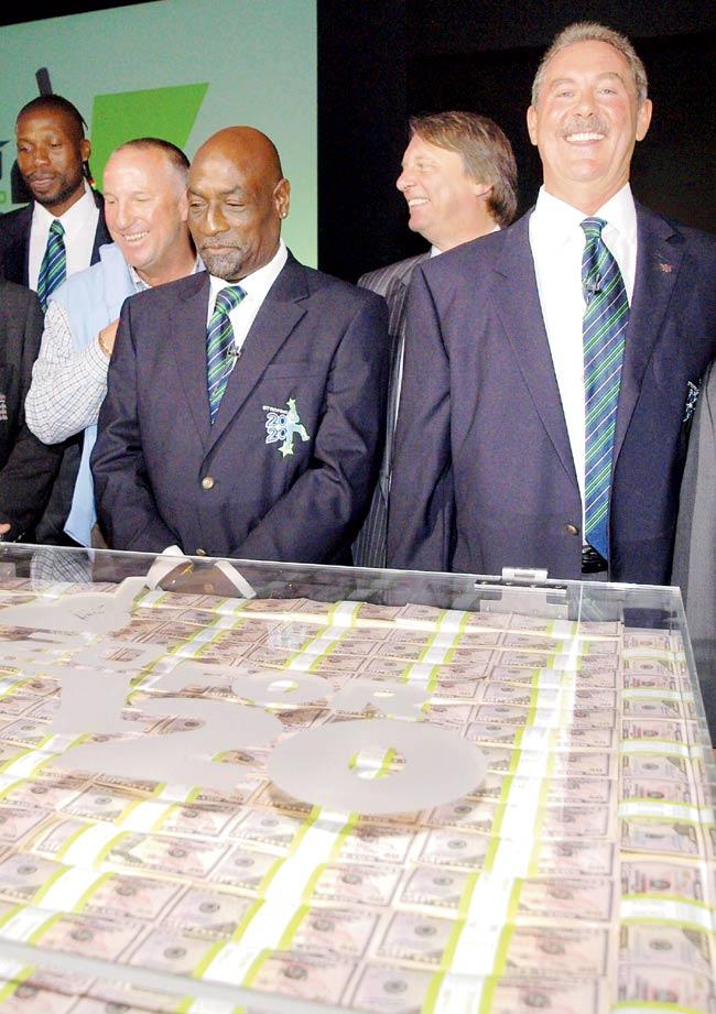 England great Ian Botham left with Viv Richards, ECB boss Giles Clarke and Allen Stanford right in front of a case containing 20 million US dollars