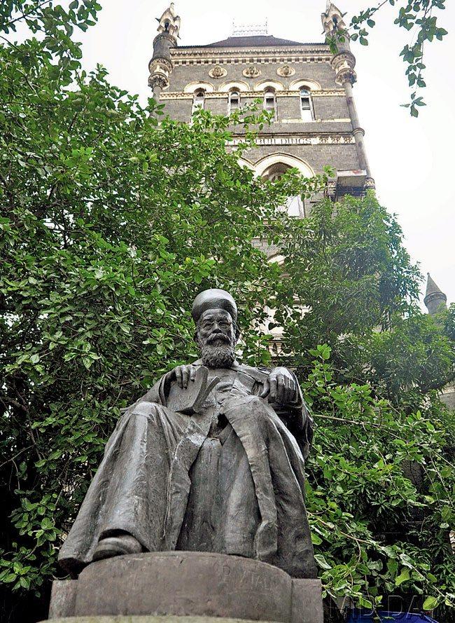 The stone statue of  Dr Dadabhai Naoroji near Flora Fountain