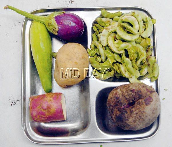 Undhiyu  is made of brinjal,  Surti papdi, Kand (purple yam), Sakariya (sweet potato) and Arya Kakdi (cucumber)