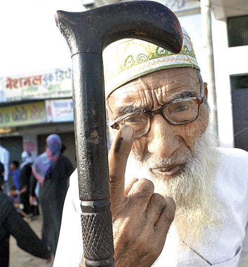 A man shows his inked finger at Thakurdwara, Moradabad. Pic/PTI