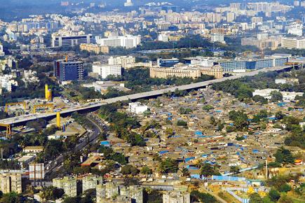Who will demolish the slums near the airport?