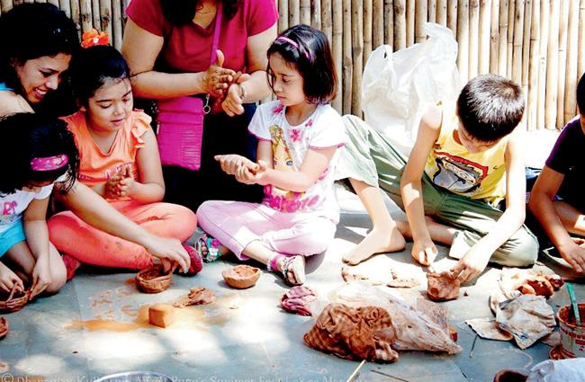 Children participating at a clay modelling workshop in the last edition of West Pune’s Monsoon Fest