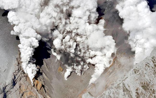 Dense fumes spewed out from several spots on the slope of Mount Ontake as the volcano erupted in  central Japan.