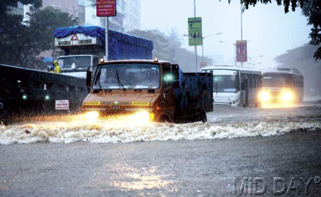 Water logging was observed on various roads and traffic snarls increased during morning and evening peak hours. Pic/Satyajit Desai