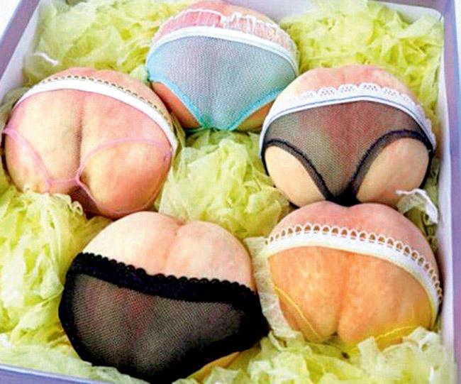Bum deal: A punnet of nine peaches dressed in lingerie costs a shocking £50. Pic/Agencies