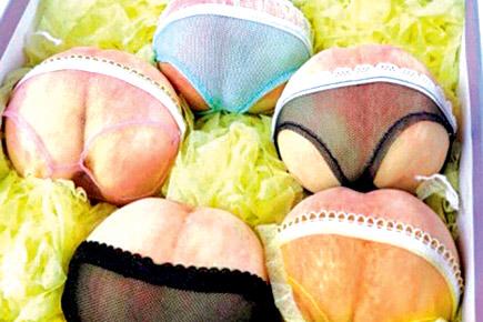 Chinese grocer puts panties on peaches to boost sales!