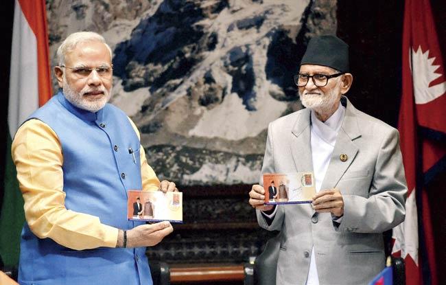 Prime Minister Narendra Modi and his Nepali counterpart Sushil Koirala during the signing ceremony at Chambers PMO, Singha Durbar in Kathmandhu, Nepal on Sunday. Pic/PTI