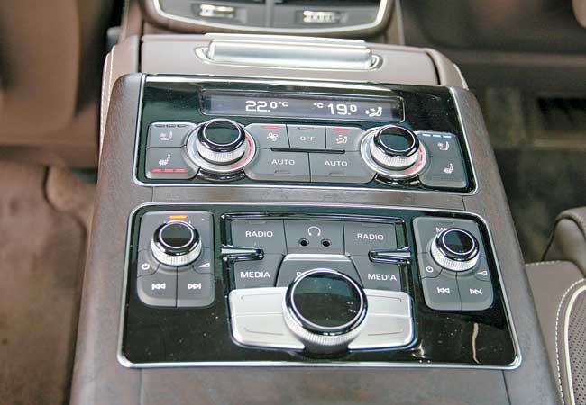 The backseat has a multimedia infotainment system. Occupants can use individual headphones for playing media of their choice