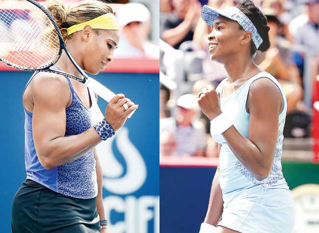 Serena Williams (left) reacts after losing a point against sister Venus (right) in the semi-finals of the Montreal WTA event yesterday. Pics/AFP