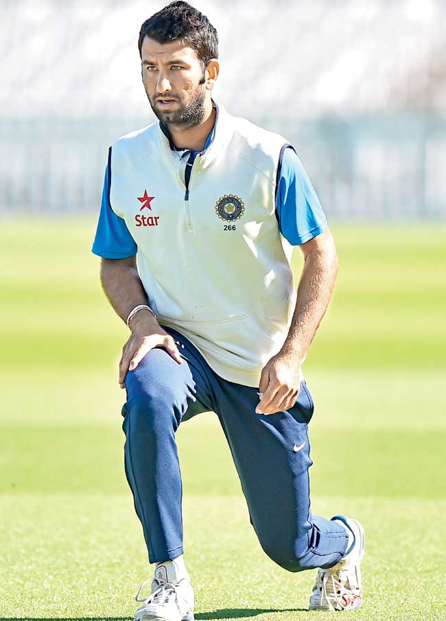 Cheteshwar Pujara stretches during a practice session at The Oval on Wednesday. Pic/AFP
