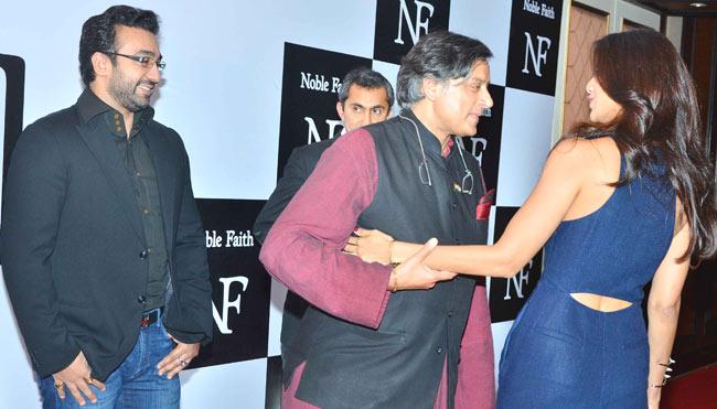 Shilpa Shetty and (in the pic left to her) with Shashi Tharoor as her husband, Raj Kundra looks on