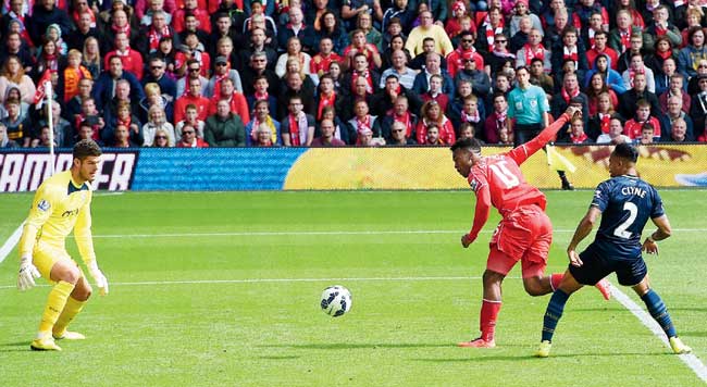 Daniel Sturridge (centre) scores Liverpool