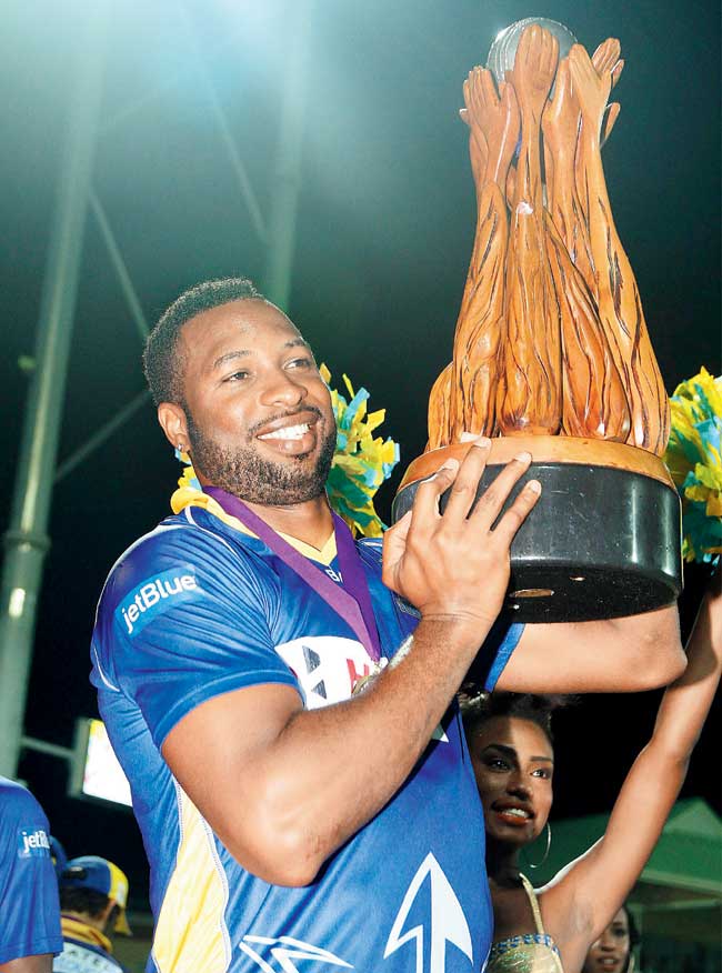 Barbados Tridents captain Kieron Pollard poses with the Limacol Caribbean Premier League 2014 trophy. Pic/Getty Images