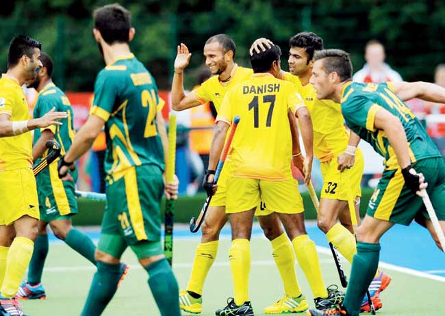 India hockey players celebrate a goal against South Africa at the CWG in Glasgow yesterday. India won 5-2 