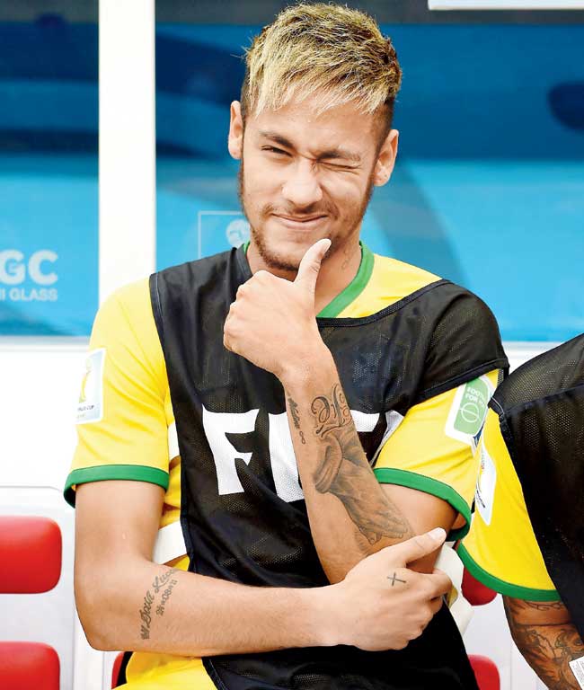 Neymar flashes a thumbs-up sign during Brazil