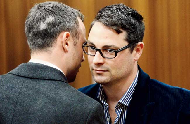 Oscar Pistorius with his brother Carl (right). Pic/AFP