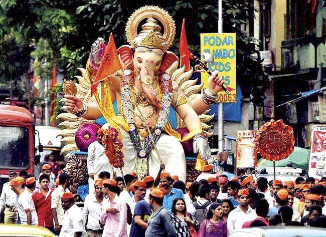 With a week to go before the festival begins, the potholes need to be filled urgently, as devotees have already begun taking idols to the pandals. File pic