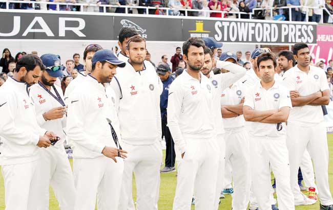 A dejected Indian team looks on after the 1-3 series loss against England at the Oval in London on Sunday. Pic/AFP
