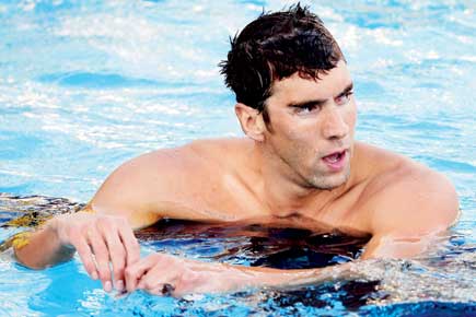 Michael Phelps wins 1st gold on international comeback