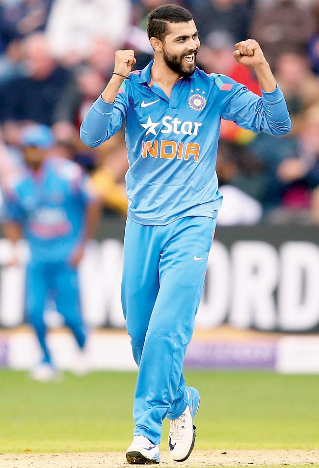Ravindra Jadeja celebrates the wicket of Jos Buttler in Cardiff yesterday. He finished with 4-28. Pic/Getty Images