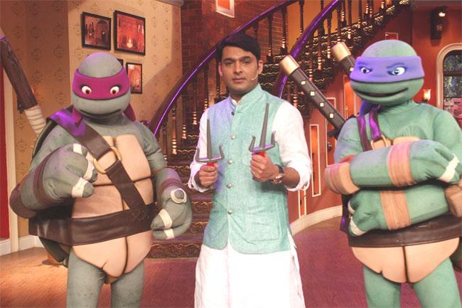 Comedian Kapil Sharma poses with Teenage Mutant Ninja Turtles on his show 