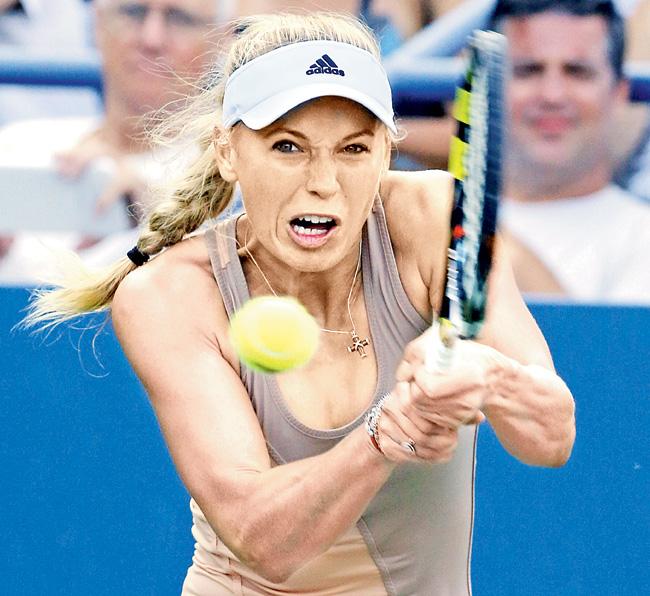 Caroline Wozniacki returns to Aliaksandra Sasnovich during her US Open singles match in New York on Wednesday. Pic/AFP