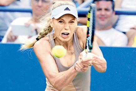 US Open: Caroline Wozniacki has bad hair day during match