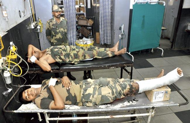 Border Security Force (BSF) soldiers injured in cross-border firing undergo treatment at a hospital in Jammu on August 11, 2014. India accused Pakistan of injuring four people during firing along their border in Kashmir, on the eve of Narendra Modi’s visit to the disputed region