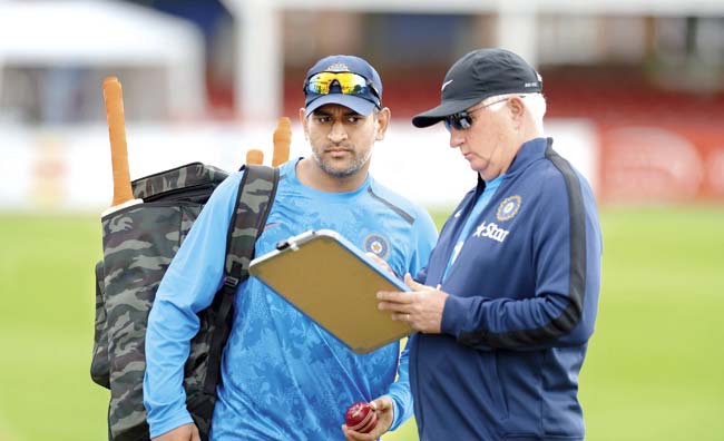 India captain M S Dhoni with head coach Duncan Fletcher. Recently, Dhoni surprisingly announced that Fletcher is still the boss of the team, even as Ravi Shastri holds the post of Team Director till the end of the ongoing limited-overs series in England. Dhoni also said that the coach will guide India to their 2015 World Cup campaign in Australia and New Zealand. Pic/Getty Images