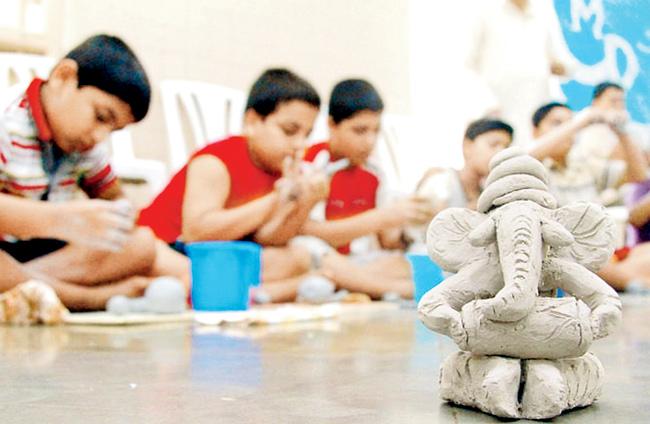 Children taking part in an eco-friendly Ganesh idol making workshop