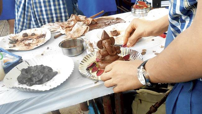 Children making eco-friendly Ganesh idols
