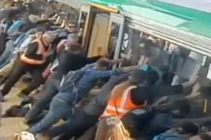 People Power: Commuters tilt train to free trapped man