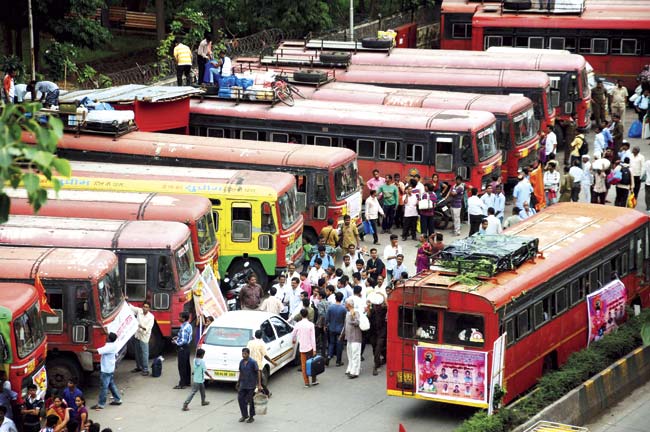 An affordable option: Commuters wait for MSRTC employees to tag the ST buses leaving for Konkan for Ganeshtostav at Dadar (West) yesterday. Pic/Satyajit Desai