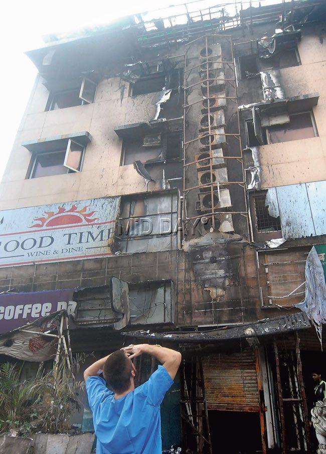The fire, which started from the air-conditioning duct of the first floor, soon spread to all three floors of the building. Pics/Sameer Markande