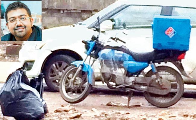 The bag of trash which was later uploaded on to the Domino’s bike, (below) Udit Sathaye, who tweeted about the incident. Pic/ Udit Sathaye