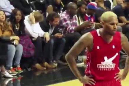Rihanna check out Chris Brown at Basketball game