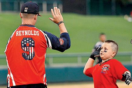 Softball camp pairs armymen and kids who've lost limbs