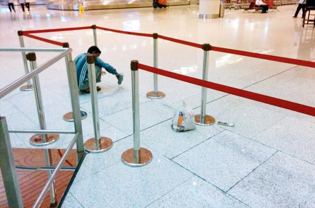 Quick fix: Repair work to replace the damaged tiles is underway at different parts of the international airport.