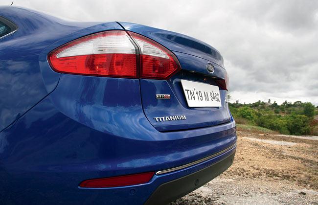 A wider integrated spoiler, restyled tail-lamps and a slim chrome garnish at the bottom work together to give the car’s rear a wider look