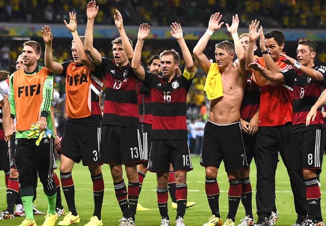 Germany-s players including L-R Germany-s goalkeeper Ron-Robert Zieler, Germany-s defender Matthias Ginter, Germany-s forward Thomas Mueller, Germany-s defender Philipp Lahm, Germany-s midfielder Bastian Schweinsteiger and Germany-s midfielder Mesut Ozil celebrate their team-s victory at the end of the semi-final football match between Brazil and Germany at The Mineirao Stadium in Belo Horizonte. Pic/AFP