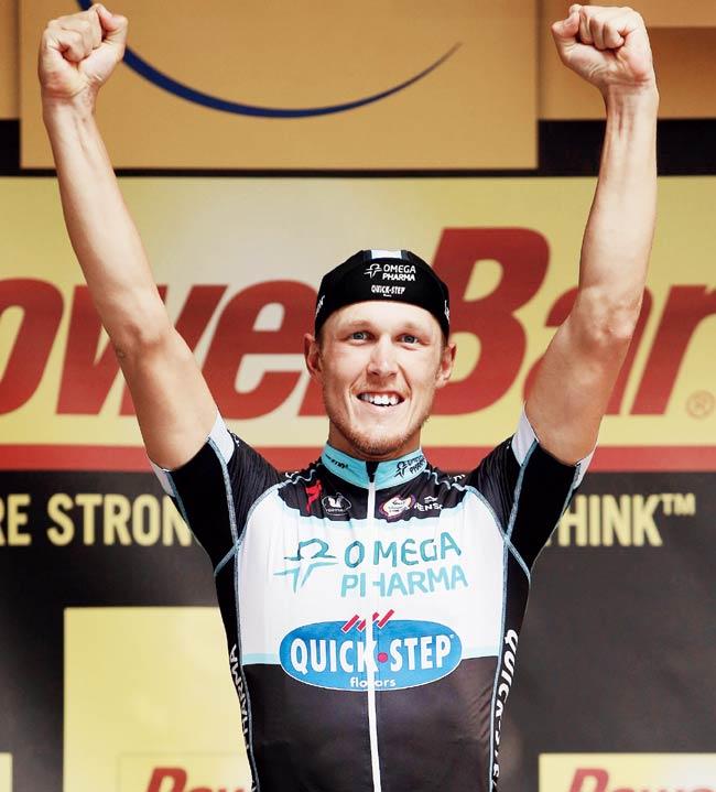 Matteo Trentin of Omega Pharma-Quick-Step Cycling team celebrates on the podium yesterday after winning Stage 7. Pics/Getty Images