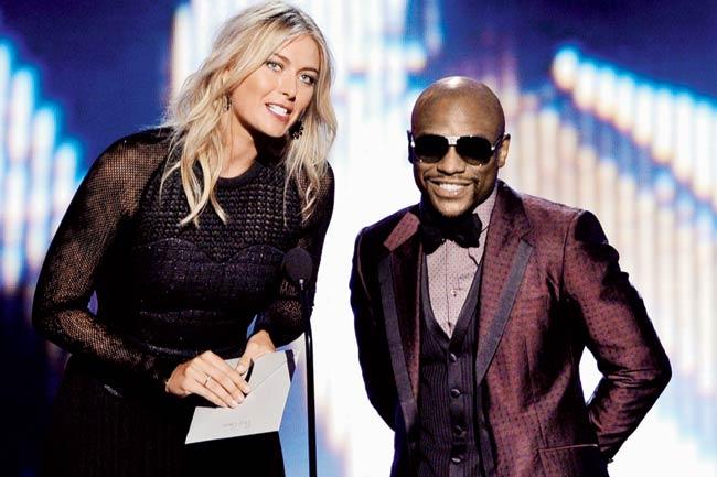 Maria Sharapova and boxer Floyd Mayweather Jr on at the 2014 ESPYS awards in LA on Wednesday.Pics/AFP