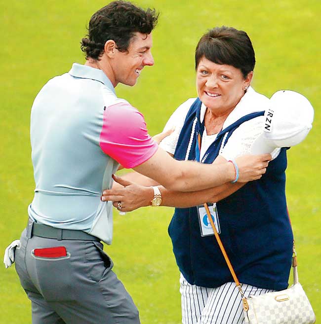 Rory McIlroy celebrates the British Open win with his mother Rosie in Hoylake, England yesterday