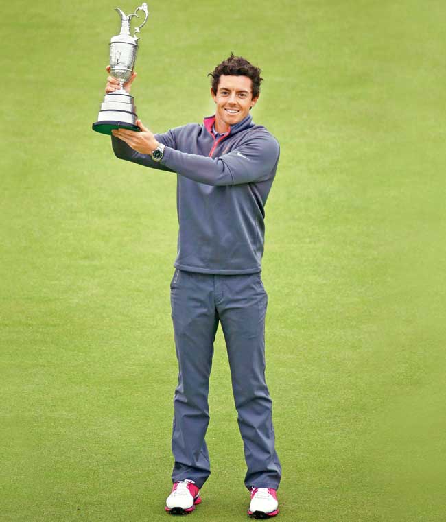 Rory McIlroy with his British Open trophy. Pic/Getty Images