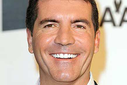 Simon Cowell denies being gay 
