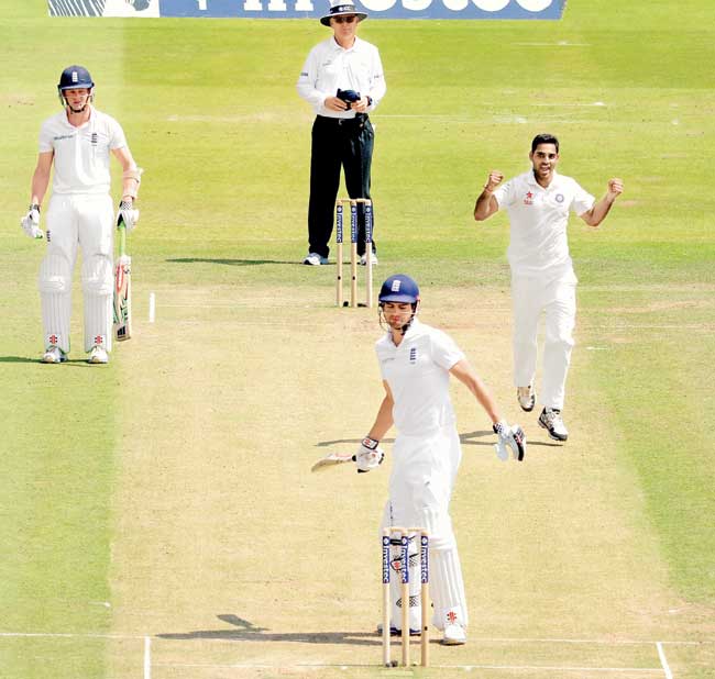 India paceman Bhuvneshwar Kumar celebrates the wicket of England captain Alastair Cook during Day Two of the second Test at Lord