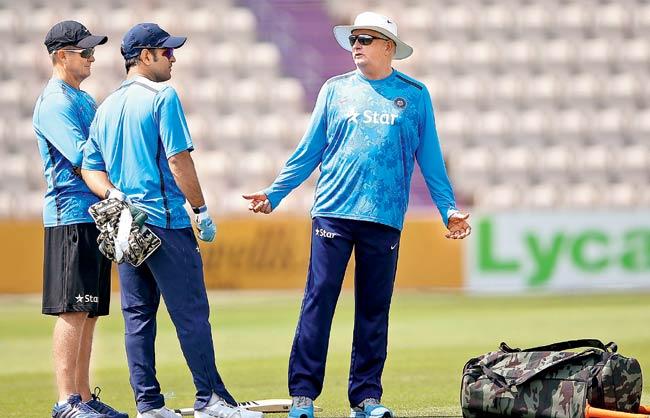 Coach Duncan Fletcher talks to MS Dhoni during a practice session in Southampton on Saturday. Pic/Getty Images