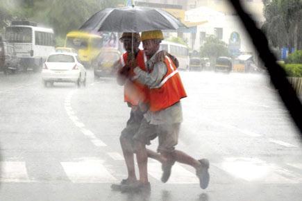 Mumbai rains: Roads turn rivers, trees fall, sparks fly